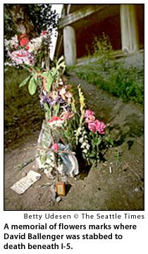 A memorial of flowers marks where David Ballenger was stabbed to death beneath I-5.