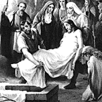 The body of Jesus is laid in the tomb.